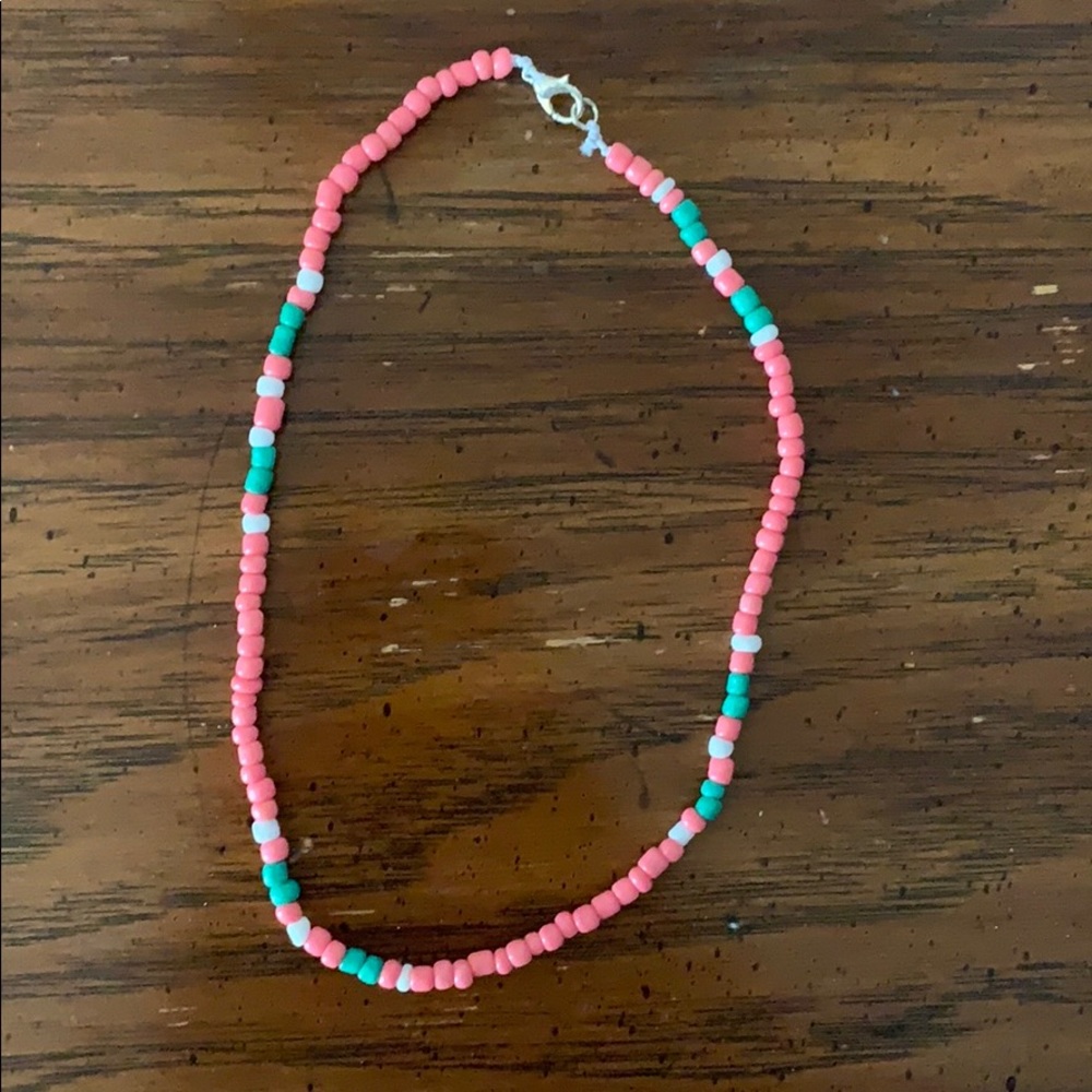 pink,teal, and white bead chocker